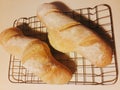 Two baguettes on a baking grid