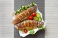 Two baked fish in a plate Royalty Free Stock Photo