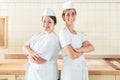 Two baker women standing proud in their bakery Royalty Free Stock Photo