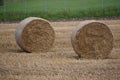 Two bales of hay in the field after harvest, preparing for autumn 2019. Agriculture. Haystack on a field. August countryside view