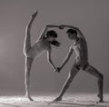 Two ballet dancers perform dance on the floor covered flour Royalty Free Stock Photo