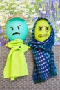 Two balloons with angry faces and shawls Royalty Free Stock Photo