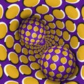 Two balls are moving in golden purple polka dots rotating hole