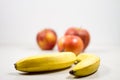 Two Bananas And Three Apples Isolated Composition on White Background