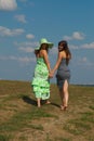 Two barefooted girls on the hill