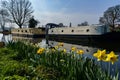 Two Barges Moored on a Canal on a Sunny Spring Morning.