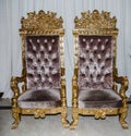 Two baroque high-backed chairs royal chairs velvet-trimmed restaurant interior decoration. Honeymoon Chairs