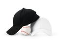 Black and White Baseball Caps Positioned Side by Side on a Clean White Background Royalty Free Stock Photo