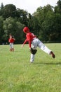 Two baseball teammates warming up for a game