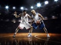 Two basketball players in action Royalty Free Stock Photo