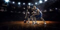 Two basketball players in action Royalty Free Stock Photo