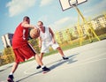 Two basketball players on the court Royalty Free Stock Photo