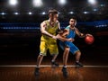 Two basketball players in scrimmage during basketball match