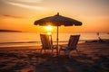 Two beach chairs and a little table with a colorful parasol directly on the beach during sunset created with generative AI Royalty Free Stock Photo