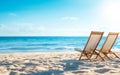 Two beach chairs on sandy shore with clear sky and ocean view Royalty Free Stock Photo