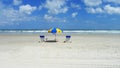 TWO BEACH CHAIRS AND SUN UMBRELLA ON A SANDY BEACH Royalty Free Stock Photo