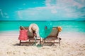 Two beach chairs on tropical vacation, family at sea Royalty Free Stock Photo