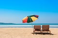 Two beach chairs and umbrella on tropical ocean beach Royalty Free Stock Photo