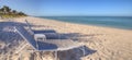 Two beach chairs under a Clear blue sky over Lowdermilk Beach Royalty Free Stock Photo