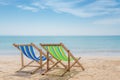 Two beach chairs on the white sand with blue sky and summer sea background. Summer, Vacation, Travel and Holiday concept Royalty Free Stock Photo