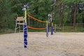 Two beach volleyball courts in a residential neighborhood