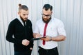 Two bearded businessman signing documents Royalty Free Stock Photo