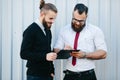 Two bearded businessman signing documents Royalty Free Stock Photo