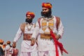 Two bearded men in retro costumes goes to Mister Desert contest