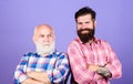 Two bearded men senior and mature. father and son family. generational conflict. male beard care. checkered fashion