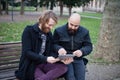 Two bearded modern man working on tablet