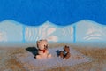 Two bears sitting on wooden deck on beach