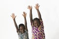 Two beautiful African children playing and having fun by showing