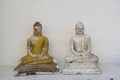 Two beautiful ancient buddhist statues at the altar in the temple Royalty Free Stock Photo