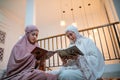 two beautiful Asian girls in hijab recite Quran Royalty Free Stock Photo