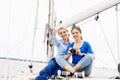 Two beautiful, attractive young girls taking pictures on a yacht Royalty Free Stock Photo