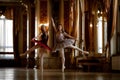 Two beautiful ballerinas dancing in a luxurious hall Royalty Free Stock Photo