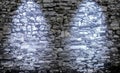 Two beautiful blue spotlights shining at an aged brick wall Royalty Free Stock Photo