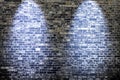 Two beautiful blue spotlights shining at an aged brick wall Royalty Free Stock Photo