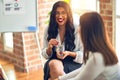 Two beautiful businesswomen smiling happy and confident Royalty Free Stock Photo