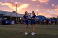 Two beautiful Cambodian hostess holds Football Trophy