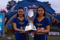 Two beautiful Cambodian hostess holds Football Trophy