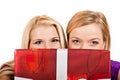 Two beautiful christmas woman holding red present Royalty Free Stock Photo