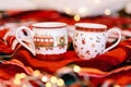 Two beautiful cups with Christmas decor. Festive atmosphere and hot cocoa cups. Christmas still life