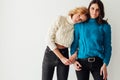 Two beautiful fashionable brunette women and blonde portrait girlfriends Royalty Free Stock Photo