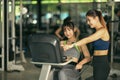 Two fitness woman working out in gym together. Royalty Free Stock Photo