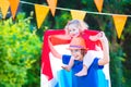 Two beautiful funny kids Dutch football supporters Royalty Free Stock Photo