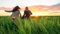 Two beautiful girl having fun together at the sunset time Royalty Free Stock Photo