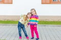 Two beautiful girlfriends posing in the garden Royalty Free Stock Photo