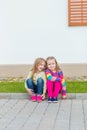 Two beautiful girlfriends posing in the garden Royalty Free Stock Photo