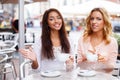 Two beautiful girls in cafe Royalty Free Stock Photo